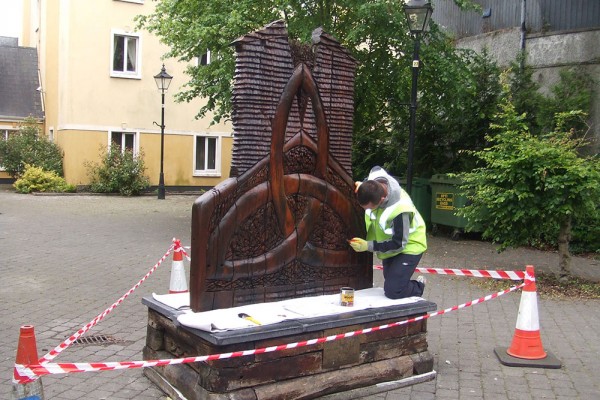 touching-up-timber-sculptures-in-ennis-2011